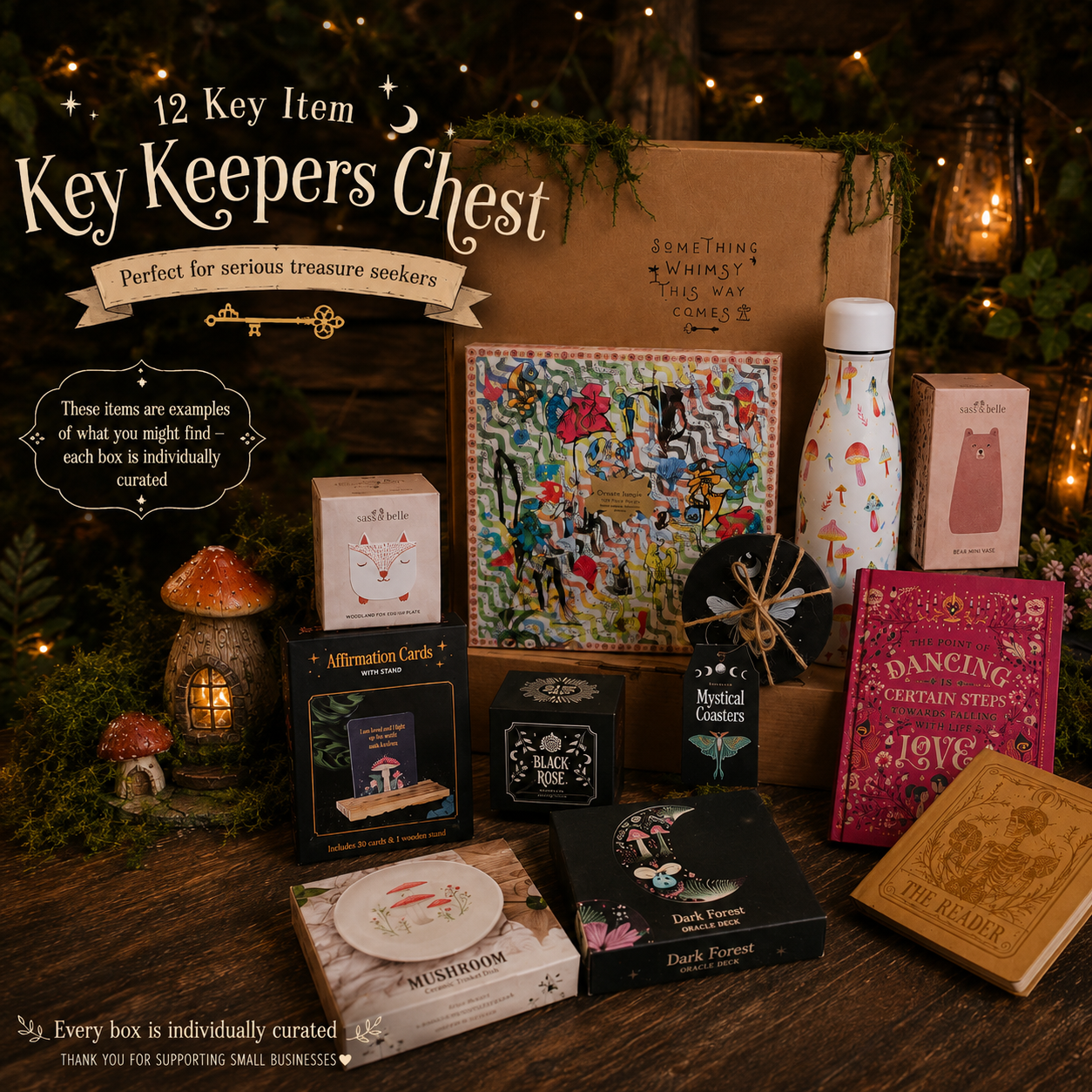 A curated key keeper treasure box set displayed on a rustic wooden table with a dark forest and fairy lights background. The set includes a brown cardboard chest, a colorful illustrated card box, a white patterned bottle, a pink book, a wooden book, and several small themed boxes and cards.